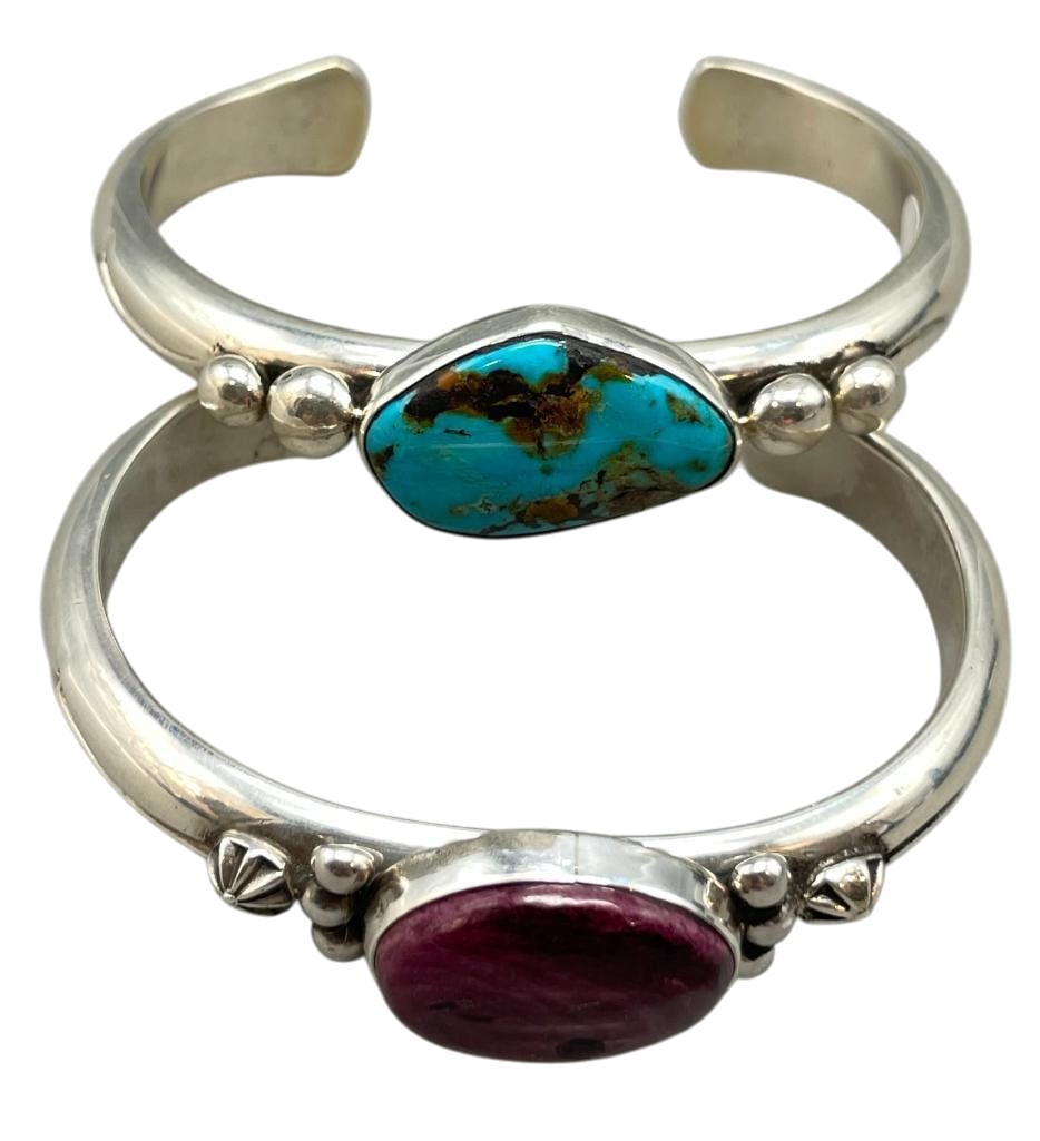 Two Nice Sterling Silver Bracelets by Alfred Lee: Offered here for your consideration are two nice sterling silver bracelets by Alfred Lee. These pieces feature a turquoise or spiny oyster cabochon set in a smooth silver bezel. Accenting the stones a
