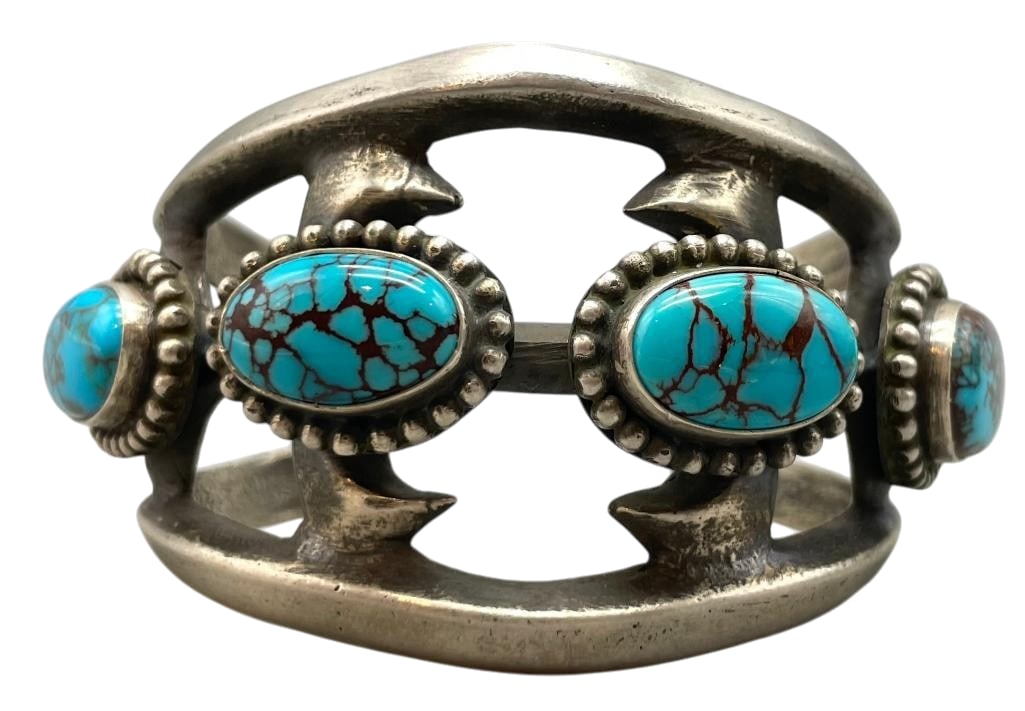 Sterling Silver Sandcast Bracelet With High Grade Turquoise: Offered here for your consideration is a sterling silver sandcast bracelet with high grade turquoise. This piece features four turquoise cabochons with great webbing set in smooth silver bezels accent