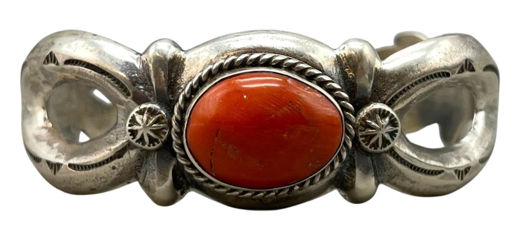 Sterling Silver Sandcast Bracelet With Nice Coral Setting: Offered here for your consideration is a sterling silver sandcast bracelet with a nice coral setting. This piece features a coral cabochon set in a smooth silver bezel accented with hand stamped dots 