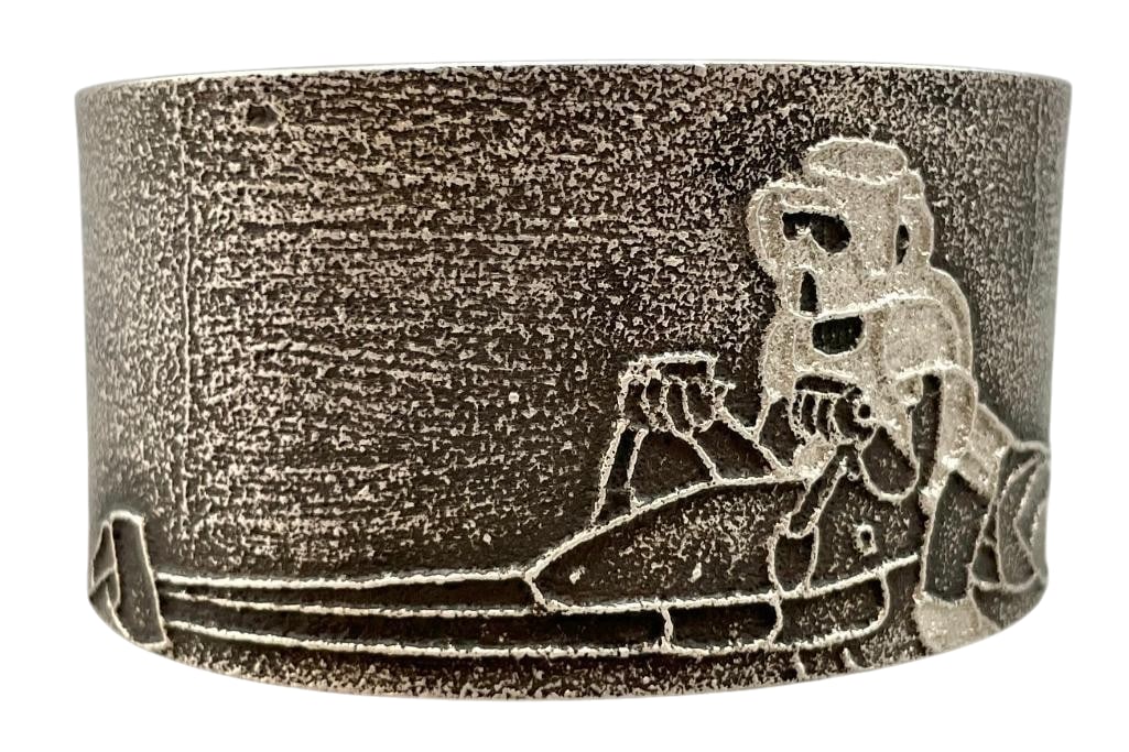 Contemporary Tufa Cast Bracelet By Nathan Begay: Offered here for your consideration is a contemporary tufa cast bracelet by Nathan Begay. This piece showcases a Star Wars theme design depicting a storm trooper riding a speeder bike. Completing the 