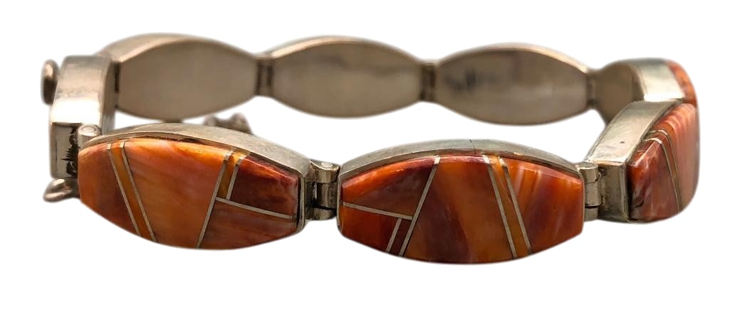 Phenomenal Spiny Oyster And Sterling Silver Bracelet By Earl Plummer: Offered here for your consideration is a phenomenal spiny oyster and sterling silver bracelet by Earl Plummer. This piece features seven links each highlighted with a spiny oyster channel inlay. The b