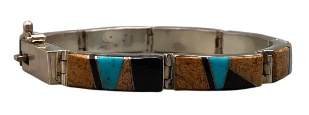 Multi Stone Coral And Sterling Silver Bracelet: Offered here for your consideration is a phenomenal spiny oyster and sterling silver bracelet by Earl Plummer. This piece features seven links highlighted with a multi stone inlay of turquoise, onyx a