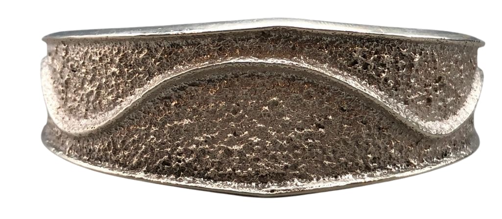 Contemporary Tufa Cast Bracelet by Lance Plummer (Son of Earl Plummer): Offered here for your consideration is a contemporary tufa cast bracelet by Lance Plummer (son of Earl Plummer). This sterling silver piece features a wavy tufa cast design with a textured background.