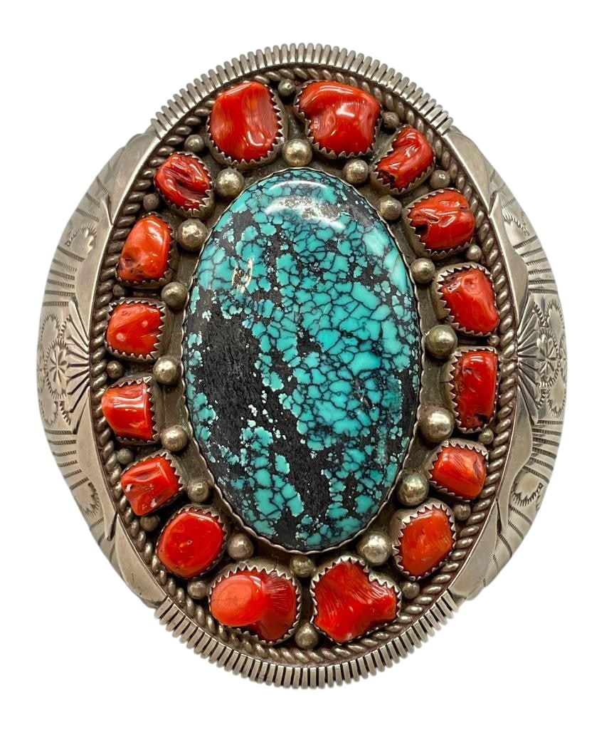 Statement Webbed Turquoise, Coral And Sterling Silver Bracelet: For your bidding enjoyment we present a statement webbed turquoise, coral and sterling silver bracelet. This bracelet features a turquoise cabochon with great webbing in the center of several coral ca