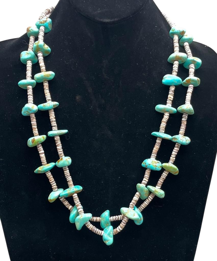 Two Strand Turquoise And Heishi Necklace: Offered here for your consideration is a two strand turquoise and Heishi necklace. This necklace features two strands of turquoise beads with Heishi shell beads between. The beads are strung on waxed 