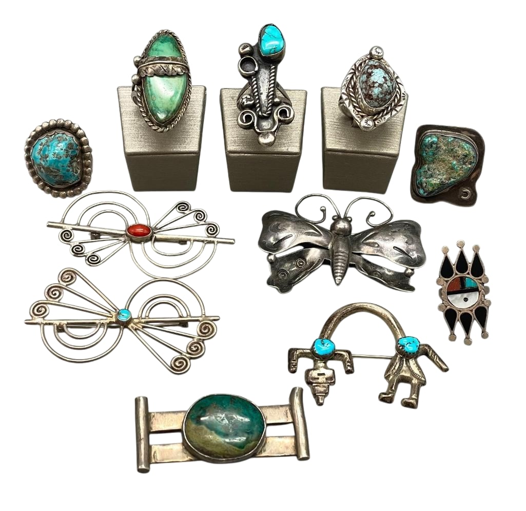 Group Of Vintage Rings And Pins: Offered here are a group of five vintage pins and six vintage rings. These pieces feature a variety of designs including cabochons of turquoise and others set in silver bezels, multi stone inlay, or s