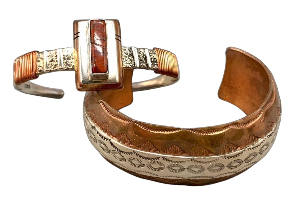 Two Copper And Sterling Silver Bracelets With Various Designs: Offered here for your consideration are two copper and sterling silver bracelets with various designs. The first bracelet features a jasper stone set in a smooth silver bezel accented with a copper in