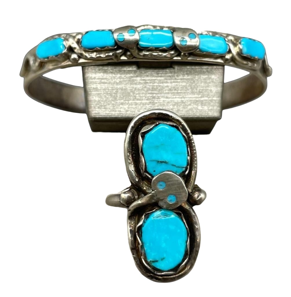 Sterling Silver And Turquoise Effie C. Bracelet And Ring: Offered here is a sterling silver and turquoise Effie C. bracelet and ring. This solid cuff and ring are both highlighted by Effie Calavaza’s signature snake motif, with coiled serpents encircling t
