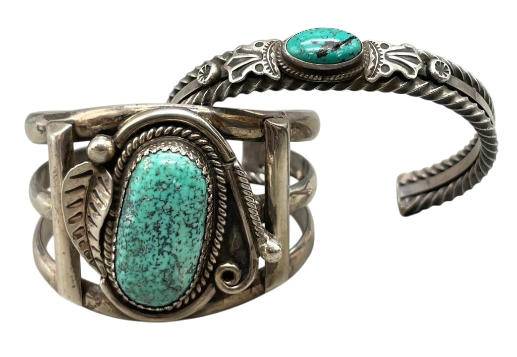 Two Sterling Silver And Turquoise Bracelets: Available here for your consideration are two sterling silver and turquoise bracelets. Both pieces feature a turquoise cabochon set in a silver bezel framed by twisted wires and other silver motifs. E
