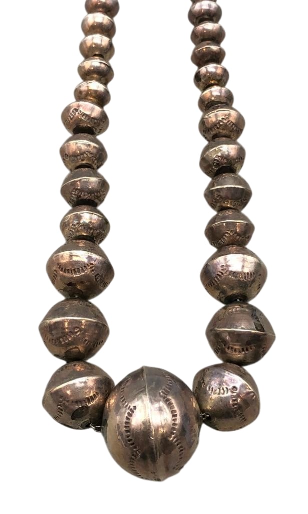 Sterling Silver Graduated Beaded Necklace: Offered here for your consideration is a sterling silver graduated beaded necklace. This necklace features handmade sterling silver beads, with the lower beads accented by stamped detailing. The beads