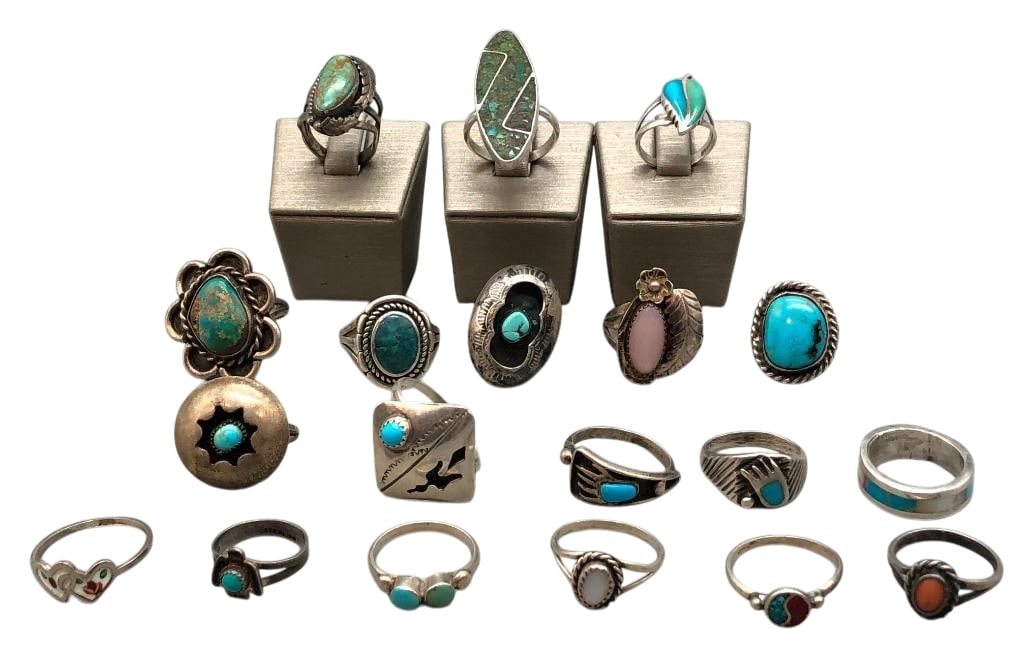 19 Sterling Silver Rings With Various Settings: Offered here are 19 sterling silver rings with various settings. These pieces showcase a variety of designs featuring turquoise and other stone cabochons, chip inlay or multi stone inlay. The stones a