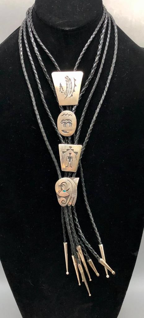 Four Sterling Silver Bolo Ties By Willie Yazzie: Available here for your consideration are four sterling silver bolo ties by Willie Yazzie. These bolos feature overlay designs of a figure, bear, elk or feather. Accenting them are darkened background