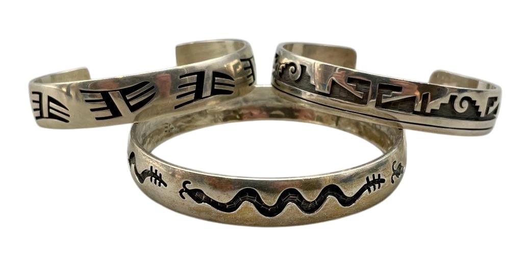 Three Sterling Silver Hopi Bracelets - One By Dawahoya: Available here for your consideration are three sterling silver Hopi bracelets - one by Bernard Dawahoya. These bracelets feature overlay designs highlighting geometrics, bear paw and snake patterns w