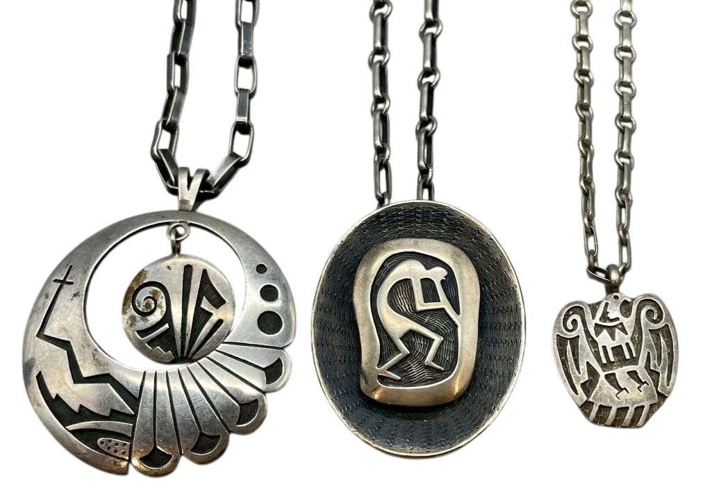 Three Sterling Silver Hopi Necklaces: Available here for your consideration are three sterling silver Hopi necklaces. These necklaces each feature a pendant highlighted with overlay designs. All of the pieces are accented with darkened si
