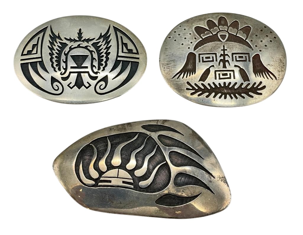 Three Sterling Silver Hopi Overlay Style Buckles: Offered here for your consideration are three sterling silver Hopi overlay style buckles. These pieces showcase a variety of overlay designs, accented by etched and darkened backgrounds that create co