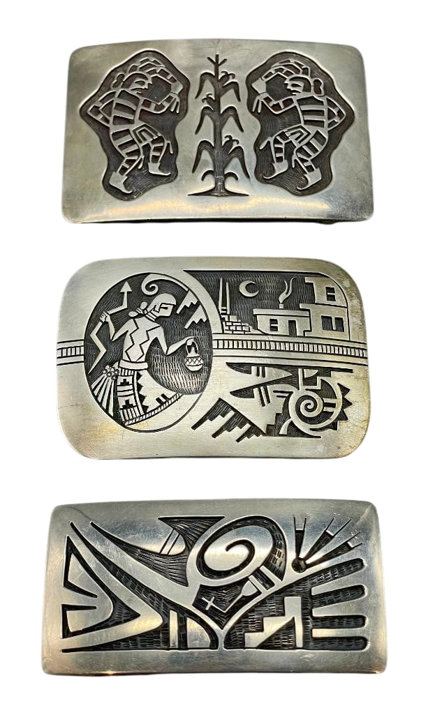 Three Sterling Silver Hopi Belt Buckles: For your bidding pleasure are three sterling silver Hopi belt buckles. These buckles features intricate overlay designs with near perfect cut outs and lines. Accenting the overlays are etched and dark