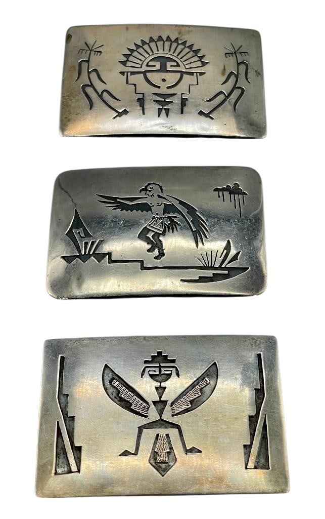 Sterling Silver Buckles By Willie Yazzie Jr.: Offered here for your consideration are three sterling silver buckles by Willie Yazzie, Jr.. Highlighting each piece is an overlay design of a Kachina/figure. Darkened backgrounds and smooth finishes 