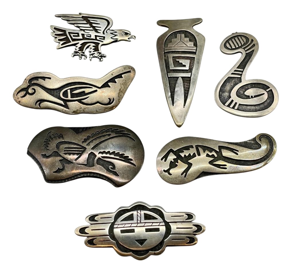 Group Of Sterling Silver Pins And Pendants: Offered here for your consideration is a group of sterling silver pins and pendants. These pieces feature overlay style designs on darkened silver backgrounds accented with etched or stippled techniqu