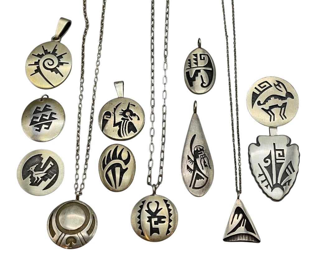 Group Of Sterling Silver Hopi Pendants: Offered here for your consideration is a group of sterling silver Hopi pendants. These pieces feature various overlay style patterns on darkened silver backgrounds. An etched technique was used to fur