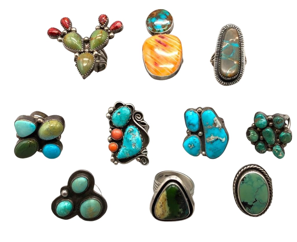 Group Of 10 Sterling Silver Rings With Various Settings: Offered here are a group of 10 sterling silver rings with various settings. These pieces showcase turquoise, coral, spiny oyster and other cabochons in a variety of designs set in silver bezels. Accen