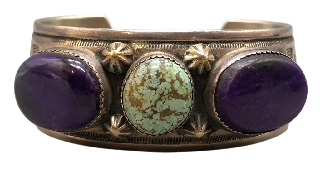 James Pioche Sterling Silver, Turquoise and Sugilite Bracelet: For your bidding enjoyment we present a James Pioche sterling silver, turquoise and sugilite bracelet. This bracelet features a central turquoise cabochon and two sugilite cabochons, all set in sawtoo