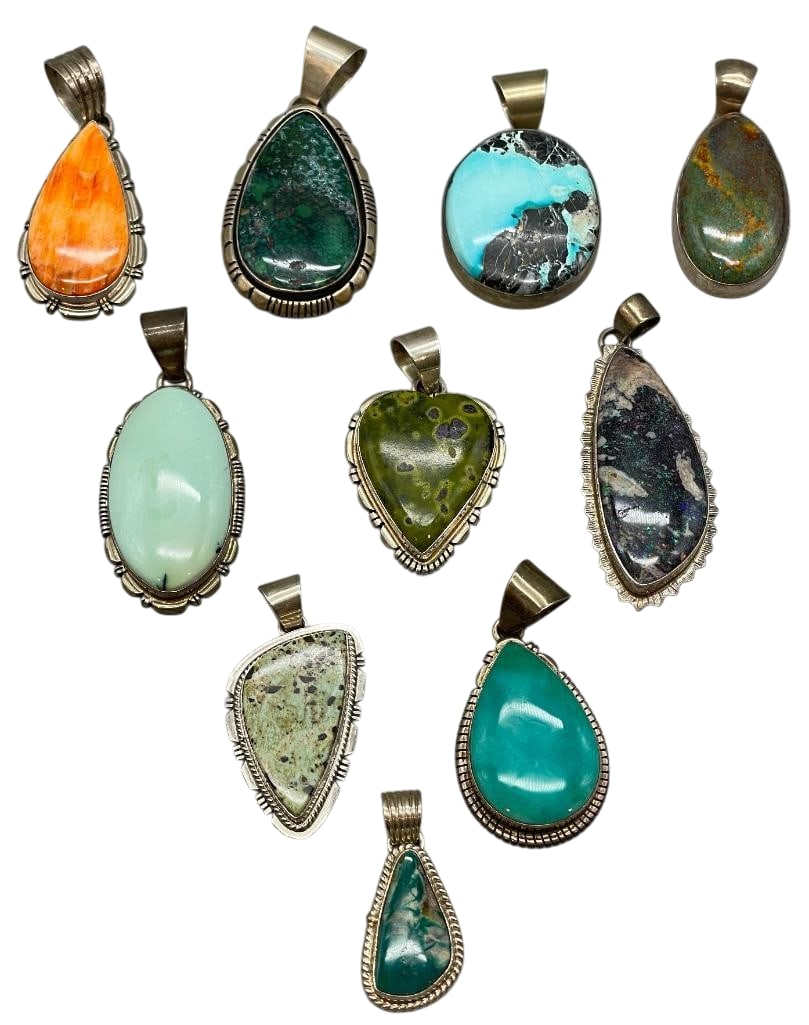10 Sterling Silver Pendants With Various Settings: Available here are 10 sterling silver pendants with various settings. These pendants are highlighted with a range of cabochons including spiny oyster, turquoise and others all set in silver bezels. Ac