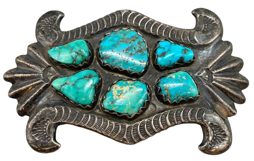 Sterling Silver And Turquoise Sandcast Buckle By Horace Iule: Available in this lot is a sterling silver and turquoise sandcast buckle by Horace Iule. This sterling silver belt buckle features six turquoise cabochons of various shapes, all set in sawtooth silver