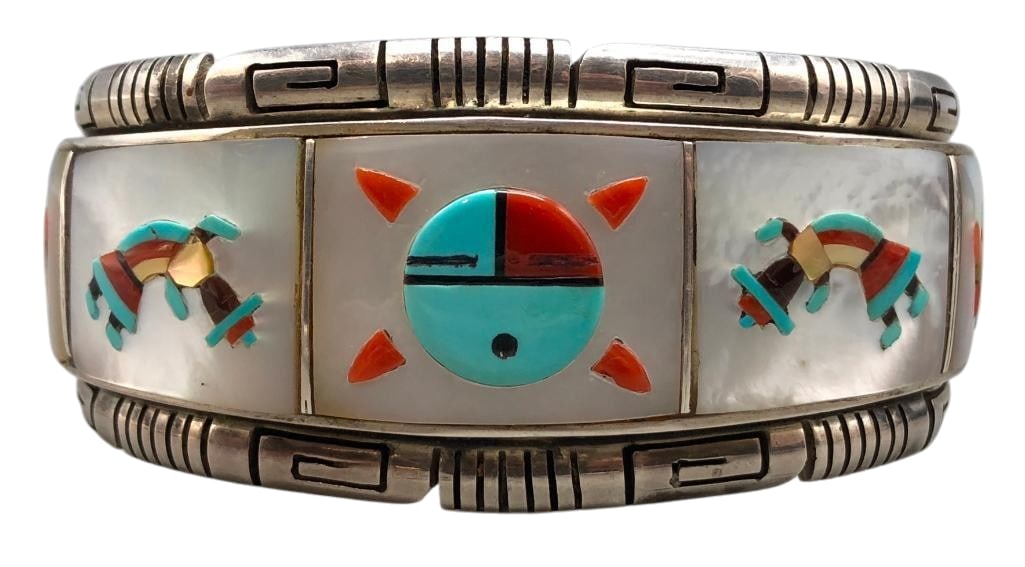 Zuni Inlay and Sterling Silver Bracelet by Francis Melvin: Offered here for your consideration is a Zuni inlay and sterling silver bracelet. This piece features seven multi stone pictorial inlay settings depicting, a Sunface, Thunderbirds or a Rainbow Man. Th