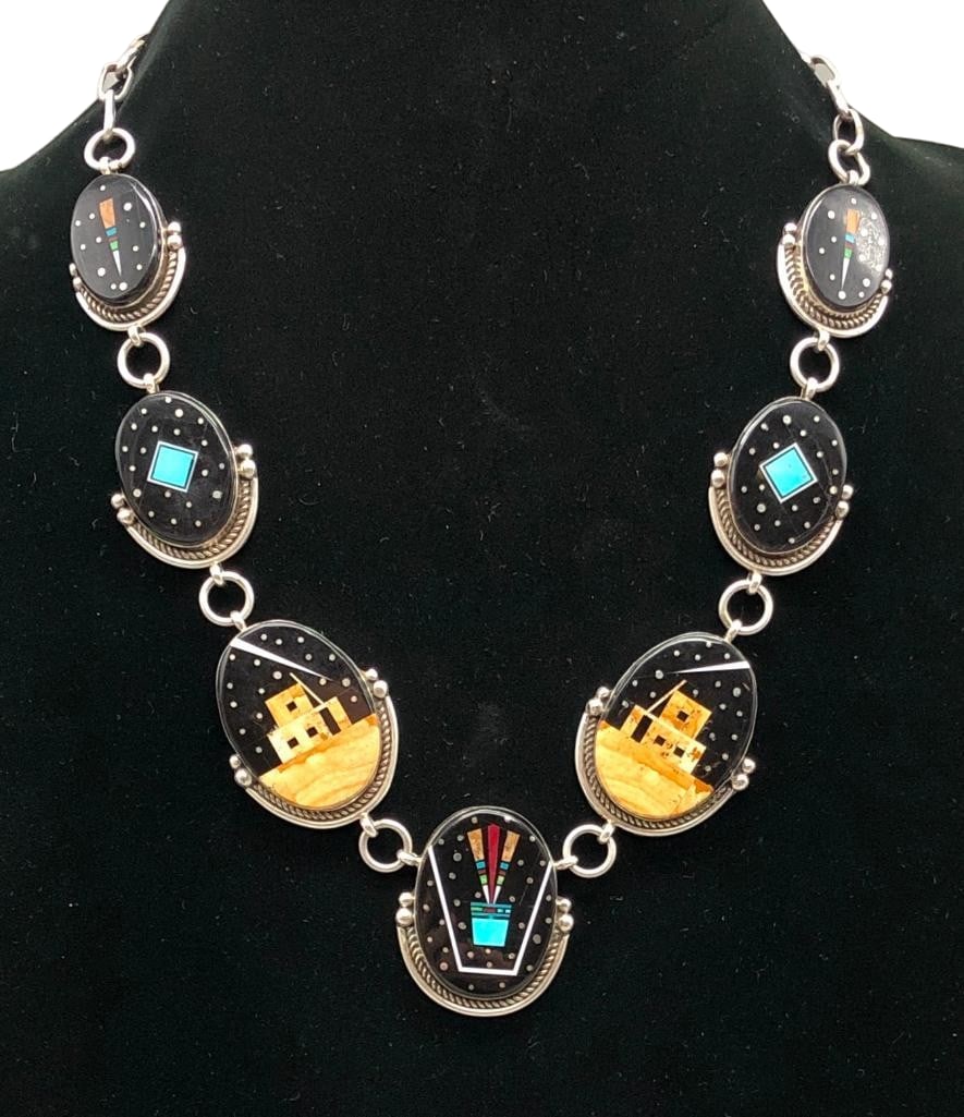 Micro Inlay Storyteller Scene Necklace: Offered here for your consideration is a micro inlay storyteller scene necklace. This piece features seven pendants each highlighted with a multi stone inlay with two depicting a Pueblo scene. The sto
