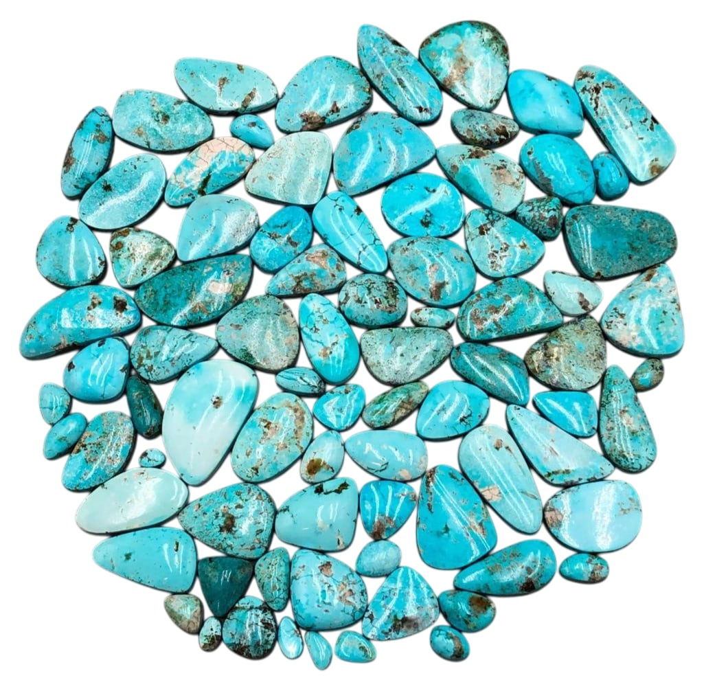 Approximately 1000 Carats Of Kingman Turquoise Cabochons: Offered here for your consideration are approximately 1000 carats of Kingman turquoise cabochons. This lot includes cut and polished light blue turquoise cabochons in a variety of sizes and shapes. Ki