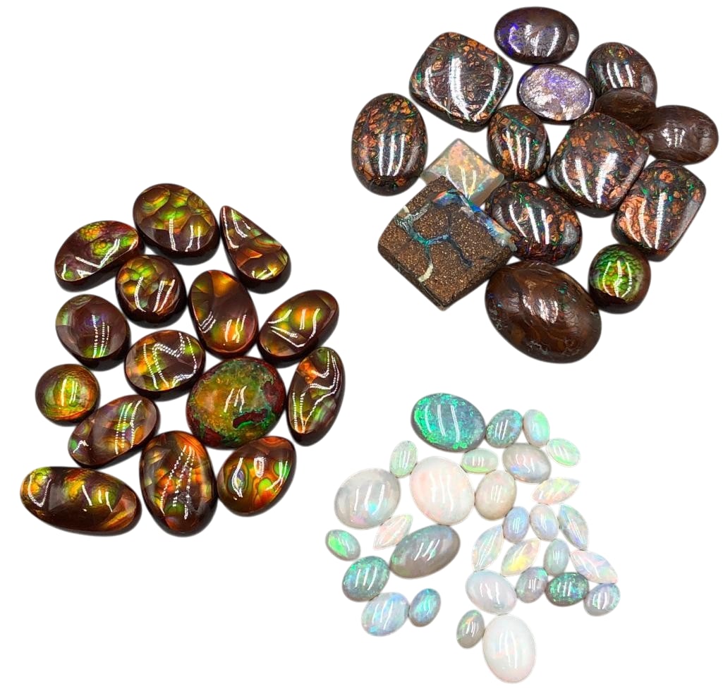 240 Carats of 3 Different Types of Opal Cabochons: Offered here for your consideration are 240 carats of three different types of opal cabochons. This lot includes cut and polished opal cabochons in a variety of sizes and shapes. The colors range from