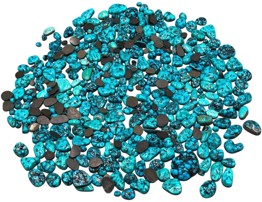 1330 Carats of Kingman Turquoise Cabochons: Offered here for your consideration are 1330 carats of Kingman turquoise cabochons. This lot includes cut and polished turquoise cabochons in a variety of sizes and shapes. The colors range from light