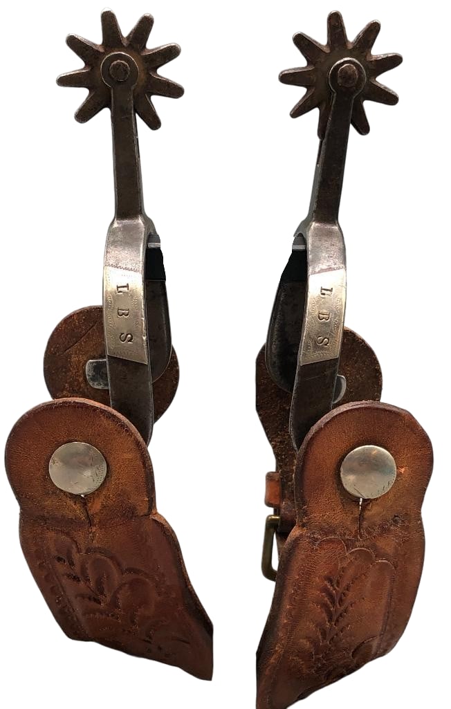 Pair of Kelly Brothers X Marked Spurs: Available here for your consideration is a rare pair of Kelly Brothers X marked spurs. These single mounted spurs feature an engraved silver overlay with the initials L B S on it. They have 10 point r