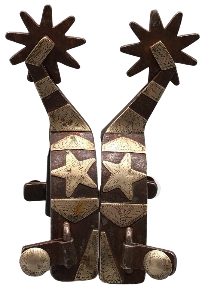 Pair of Carl Hall Texas Style Star Theme Spurs: Available here for your consideration is a pair of Carl Hall, Texas style spurs with a star theme. These single mounted spurs feature engraved silver overlay designs, including stars, along the heel b