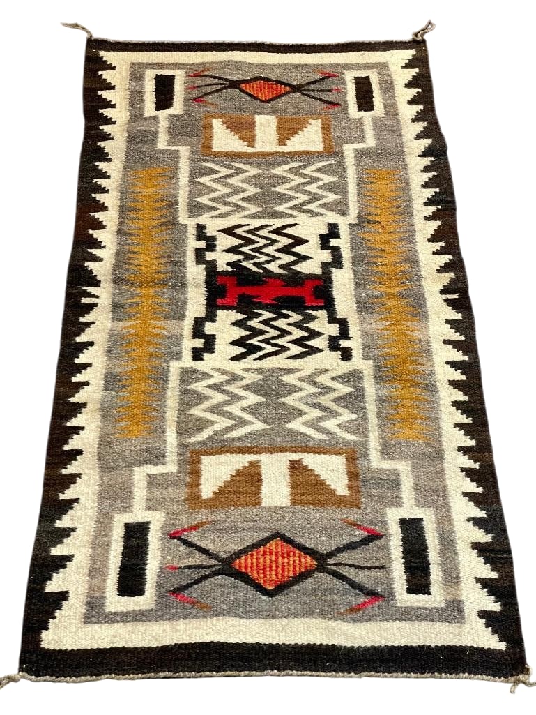 Vintage Storm Pattern Navajo Rug: Available here for your consideration is a Vintage Storm Pattern Navajo rug. This rug was woven with hand carded and hand spun wool and features a white, red, and black central design element with whi