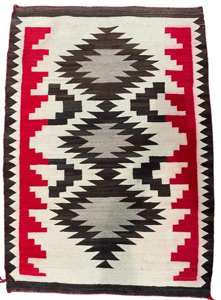 Circa 1950s Non Regional Navajo Rug: Available here for your consideration is a circa 1950s non regional Navajo Rug. This rug was woven with hand carded and hand spun wool and features geometric patterns in grey, red, and brown. This wea