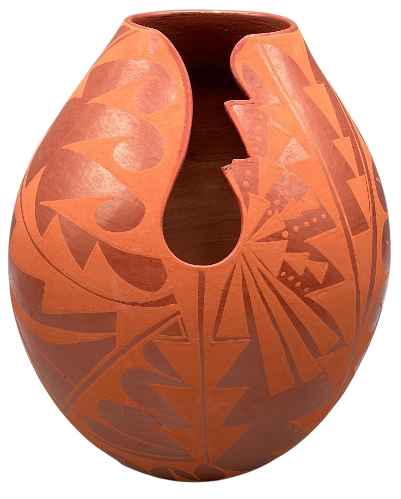 Cynthia Starflower San Ildefonso Pottery Vase: Here is your chance to own a Cynthia Starflower San Ildefonso pottery vase. This vase is a bulb shape that tapers at the top done in redware slip.There top has a dramatic cutout opening from the top d