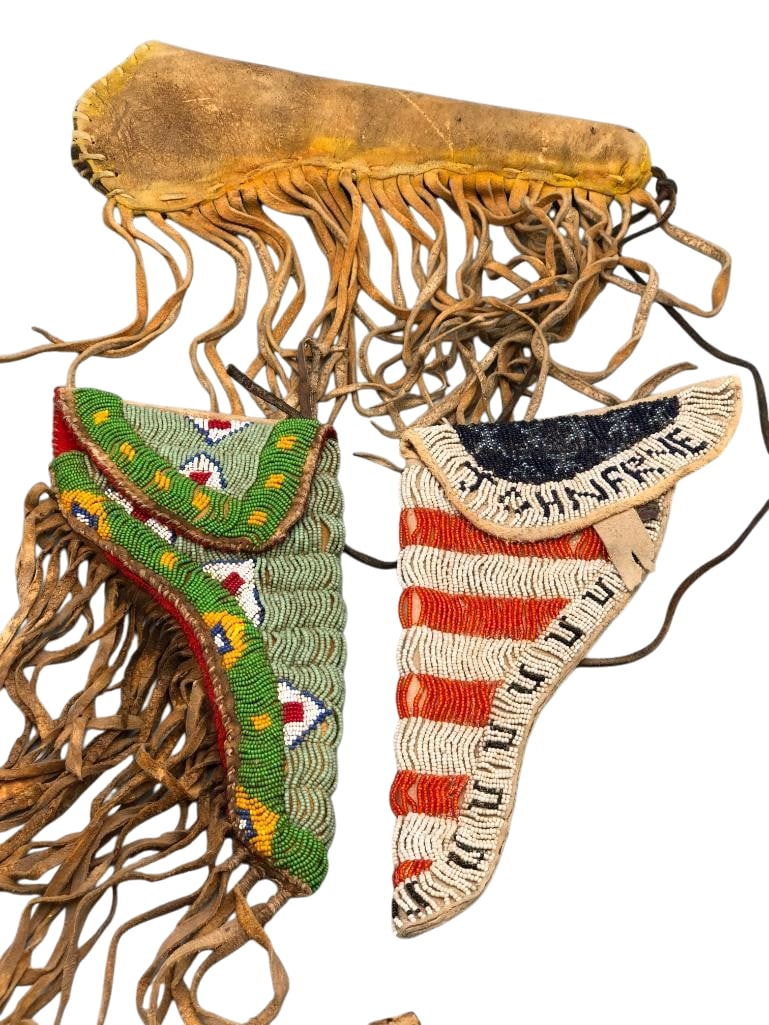 Three Leather Gun Holsters -Two Beaded: Offered here for your consideration are three leather gun holsters, two of which are beaded. Two holsters feature beadwork done in colors of green, white, red, blue, yellow and others showcasing geome