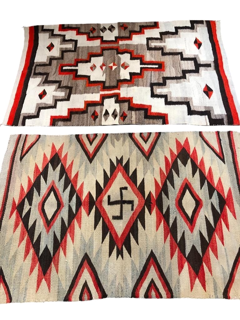 Two Antique Pound Rugs Circa 1910-1930s: Available here for your consideration are two Navajo pound rugs circa 1910 - 1930s. These rugs were woven with hand carded and hand spun wool. The first one features the Whirling Log symbol in the cen