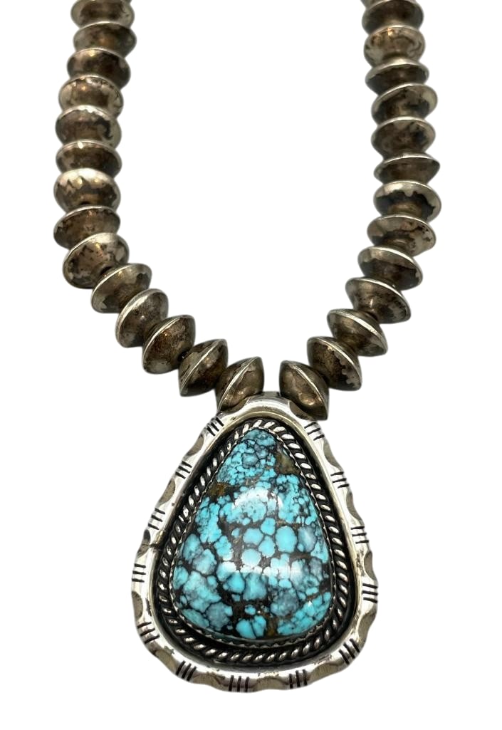Sterling Silver Beaded Necklace With High Grade Turquoise Pendant: Offered here for your consideration is a sterling silver beaded necklace with high grade turquoise pendant. The pendant features a turquoise cabochon with great webbing set in a sawtooth silver bezel 