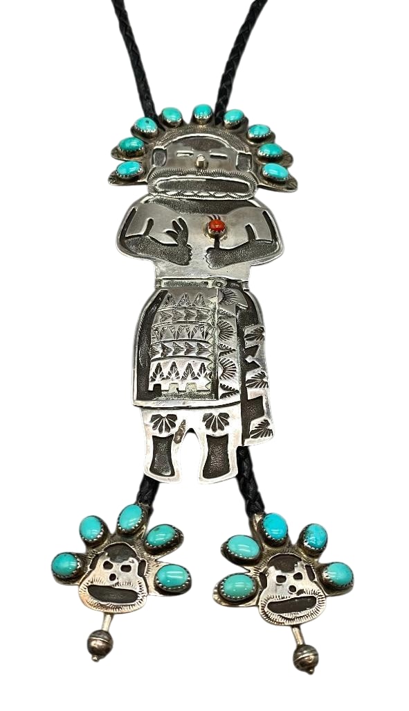 Kachina Figure Sterling Silver And Turquoise Bolo By Ben Chapo: Offered in this lot is a Kachina figure sterling silver and turquoise bolo tie by Ben Chapo. This slide has a great Kachina design highlighted with cabochons of turquoise and coral set in sawtooth sil
