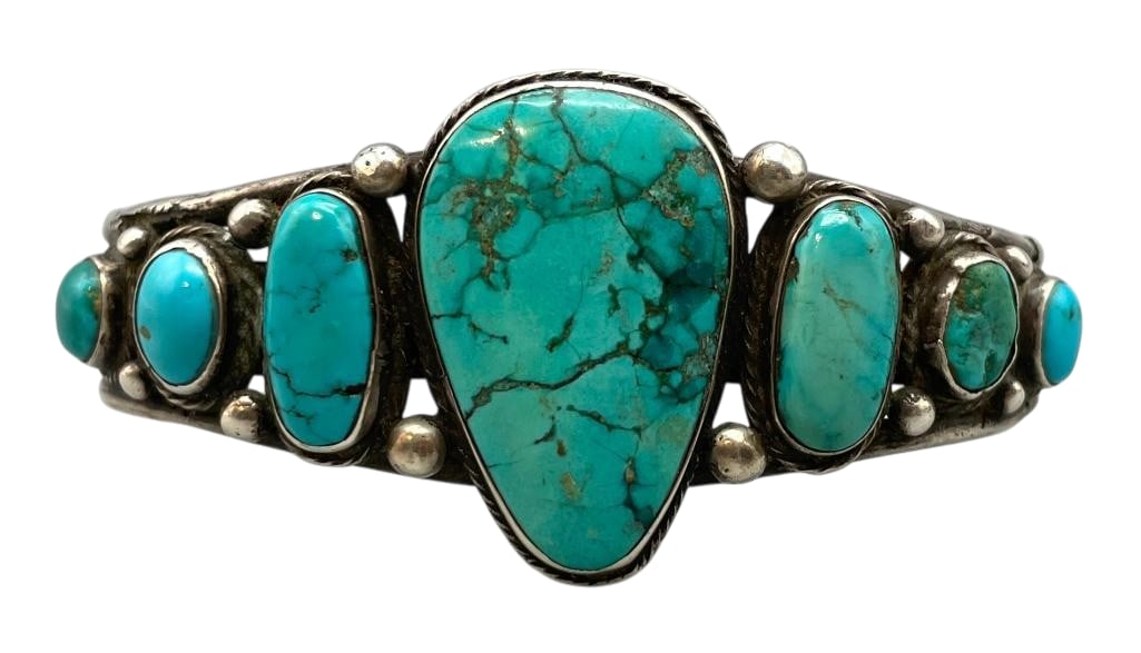 Antique Turquoise And Sterling Silver Bracelet: Offered here for your consideration is an antique turquoise and sterling silver bracelet. This piece features seven turquoise cabochons set in smooth silver bezels accented with twisted wire, silver d