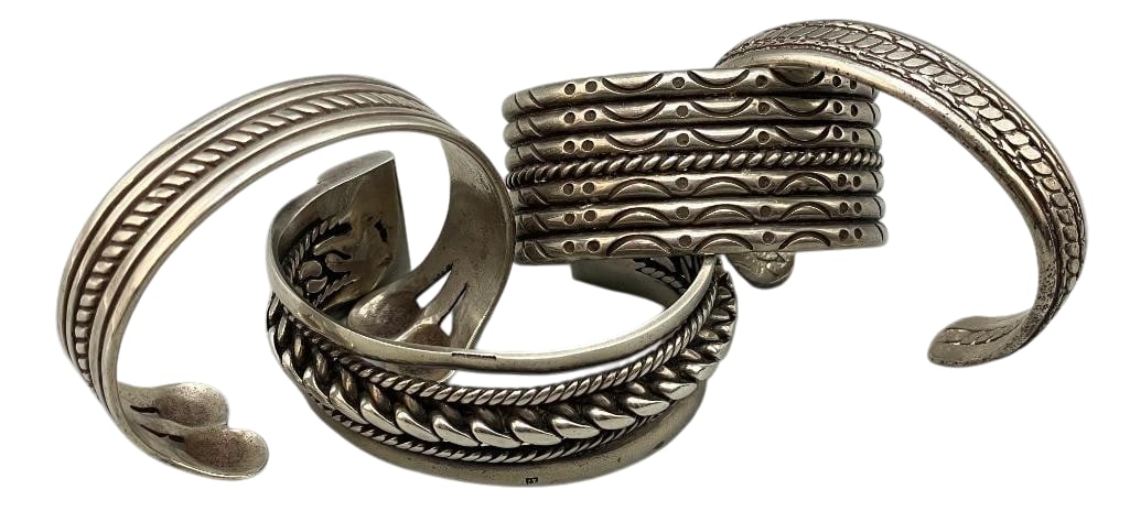 Four Sterling Silver Bracelets: Offered here for your consideration are four sterling silver bracelets. These pieces each feature a twisted wire style design, some accented with other hand stamped patterns. Three of the bracelets ar