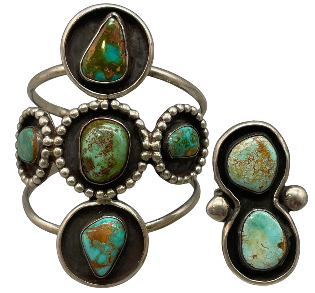 Vintage Green Turquoise And Sterling Silver Bracelet And Ring: Offered here is a vintage green turquoise and sterling silver bracelet and ring. Both pieces feature nice turquoise cabochons set in smooth silver bezels. Surrounding the stones are darkened silver ba