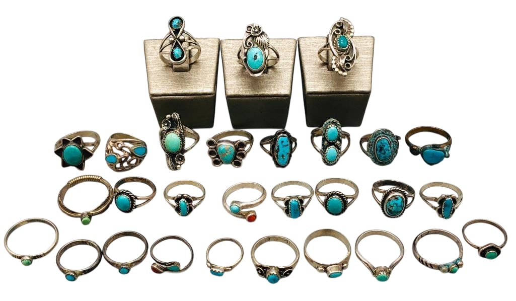 29 Vintage Rings Sterling Silver And One Brass: Offered here for your consideration are 29 vintage rings - sterling silver and one brass. Most of the pieces feature turquoise or coral cabochons set in silver bezels with silver accents. Two of the r