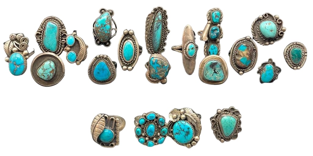 Group Of 20 Sterling Silver And Turquoise Rings: Offered here is a group of 20 sterling silver and turquoise rings. These pieces are highlighted each with turquoise cabochons set in silver bezels. *NOTE: Some of the stones have fissures/cracks. Plea