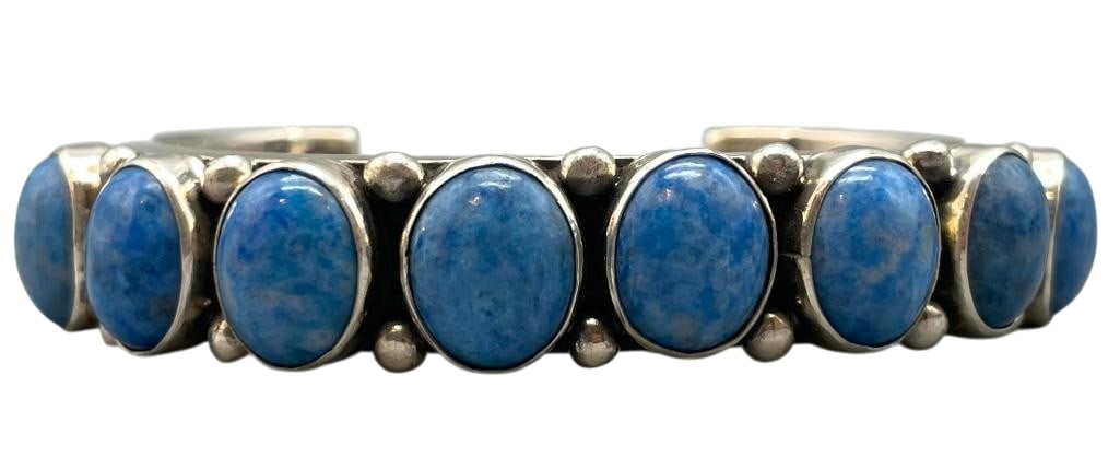Sterling Silver And Denim Lapis Bracelet By Alfred Lee: For your bidding enjoyment we present a sterling silver and denim lapis bracelet by Alfred Lee. This bracelet features a row of denim lapis cabochons set in smooth silver bezels. Accenting the stones 