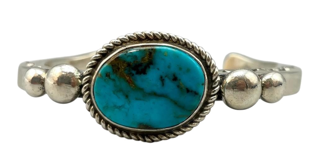 Sterling Silver And Nice Turquoise Bracelet By Alfred Lee: For your bidding enjoyment we present a sterling silver and nice turquoise bracelet by Alfred Lee. This bracelet features a nice turquoise cabochon set in a smooth silver bezel surrounded by twisted w