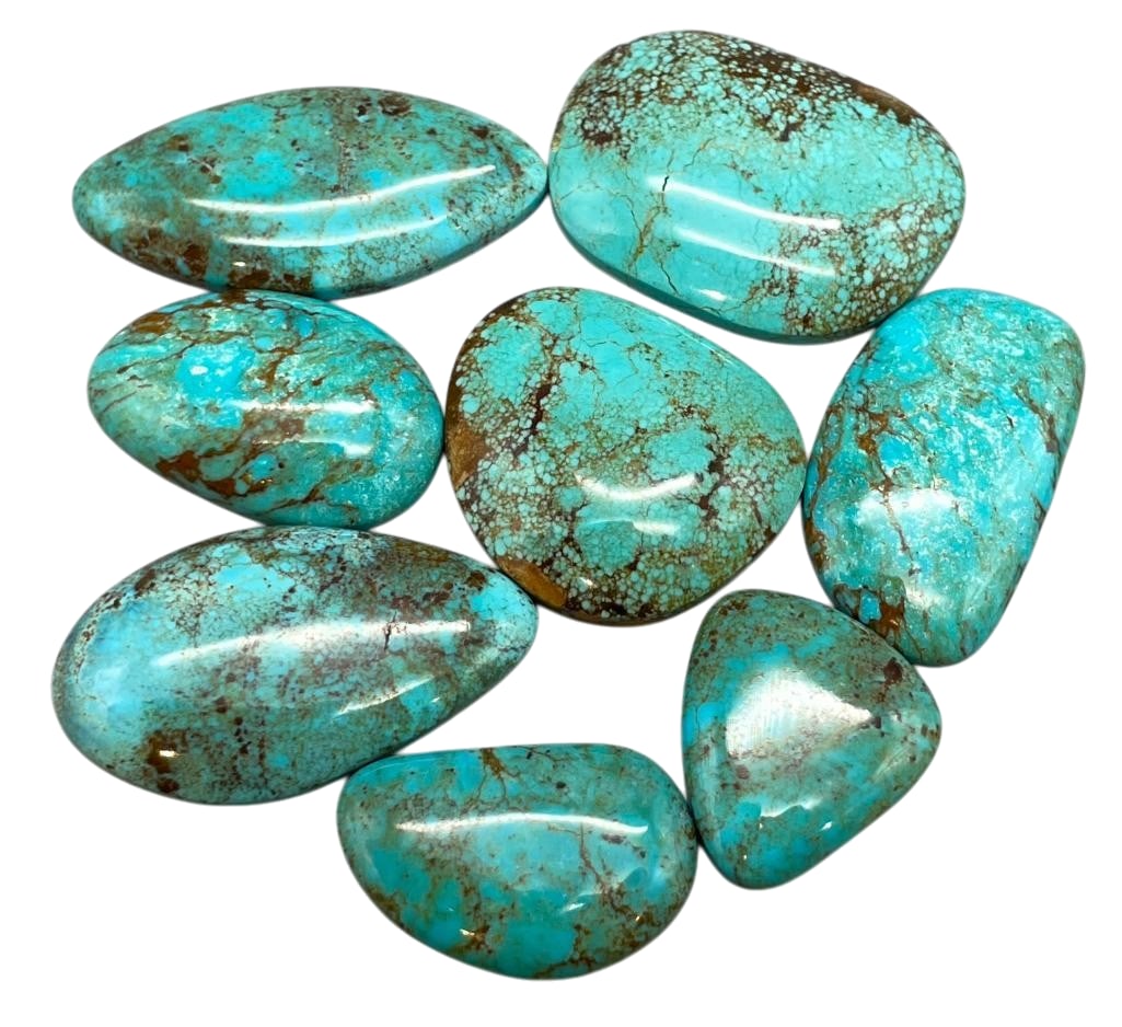 275 Carats Of Nevada Turquoise Cabochons: Offered here for your consideration are 275 carats of Nevada turquoise cabochons. This lot includes cut and polished light blue turquoise cabochons in various shapes and sizes. Some of the stones show