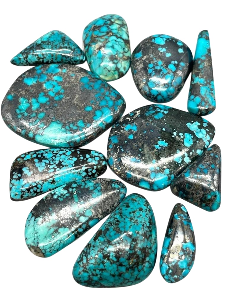 330 Carats Northern Nevada Turquoise Cabochons: Offered here for your consideration are 330 carats of Northern Nevada turquoise cabochons. This lot includes cut and polished dark blue turquoise cabochons in a variety of sizes and shapes with great 